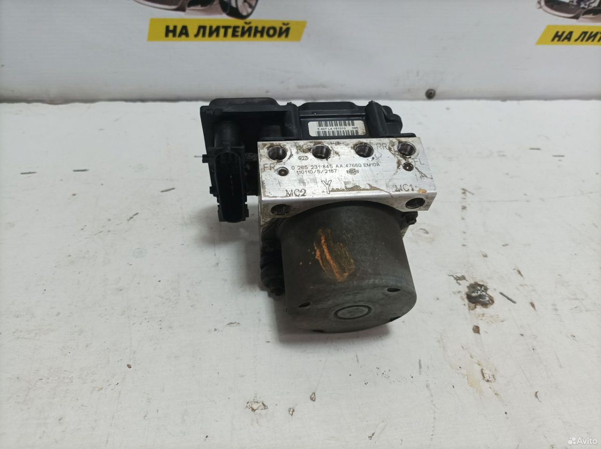 Блок ABS Nissan Tiida C11